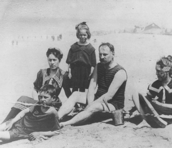 Ayres Family sitting at the beach