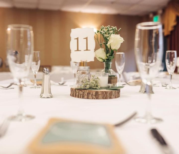 Wedding Reception Table Decor with Wine Glasses and Wooden Accents