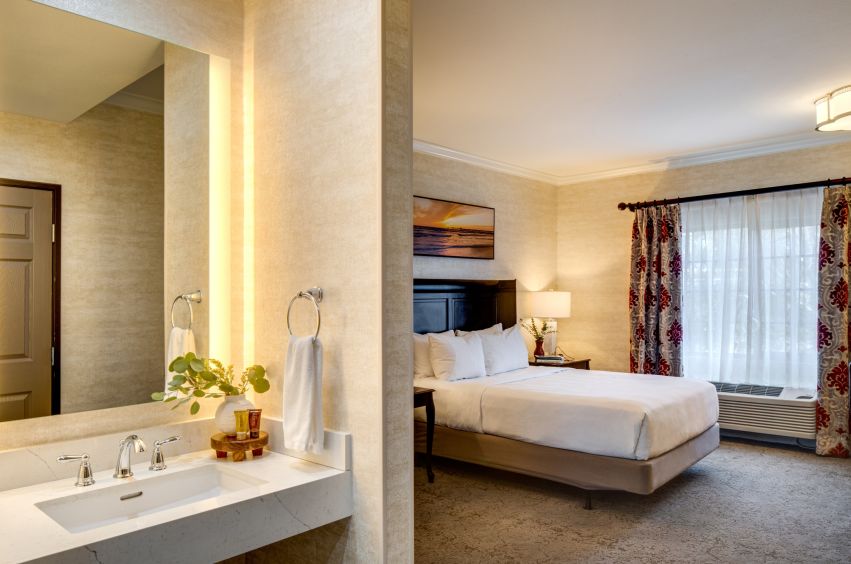 A Bathroom With A Large Bed